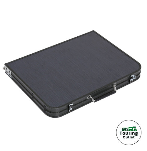 Witney black folding table folded in half with carry handle